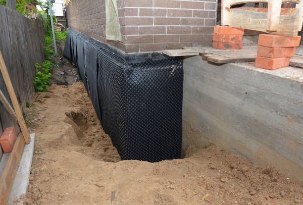 Happy homeowners after waterproofing job in Harrietta